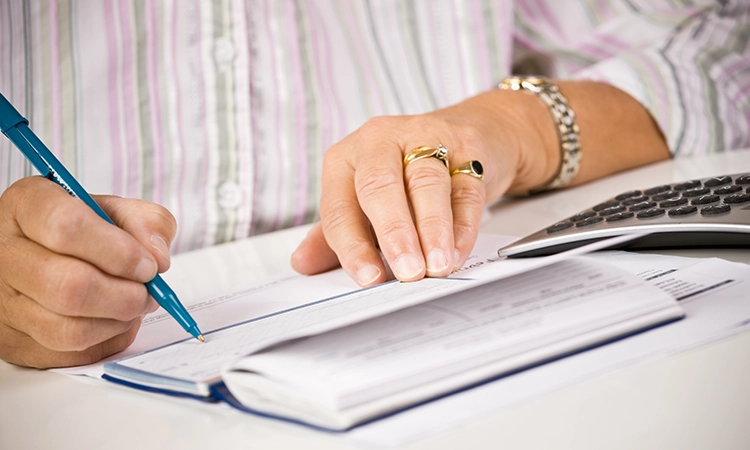 woman writing check