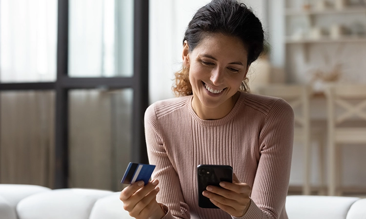 smiling woman with credit card