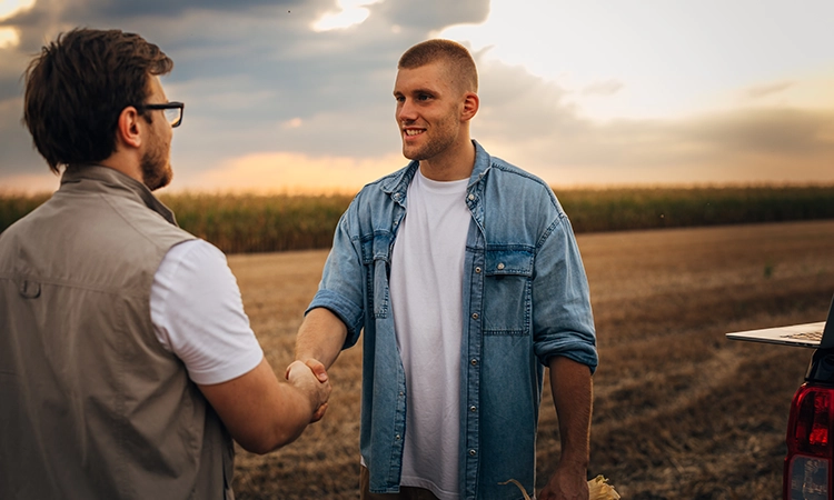 farmer and banker in field