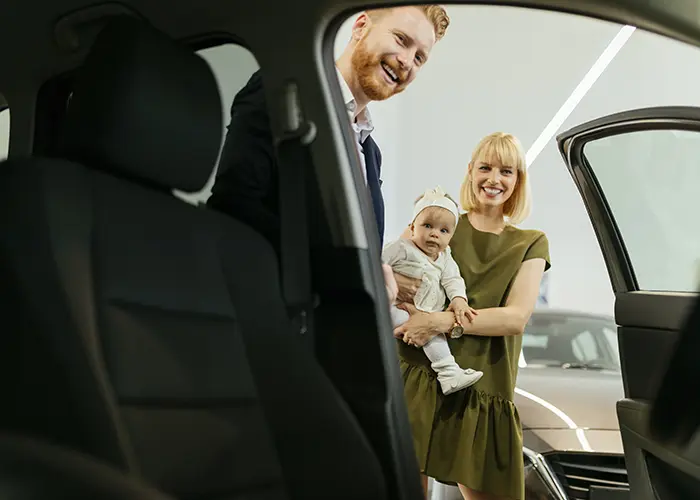 woman buying new car